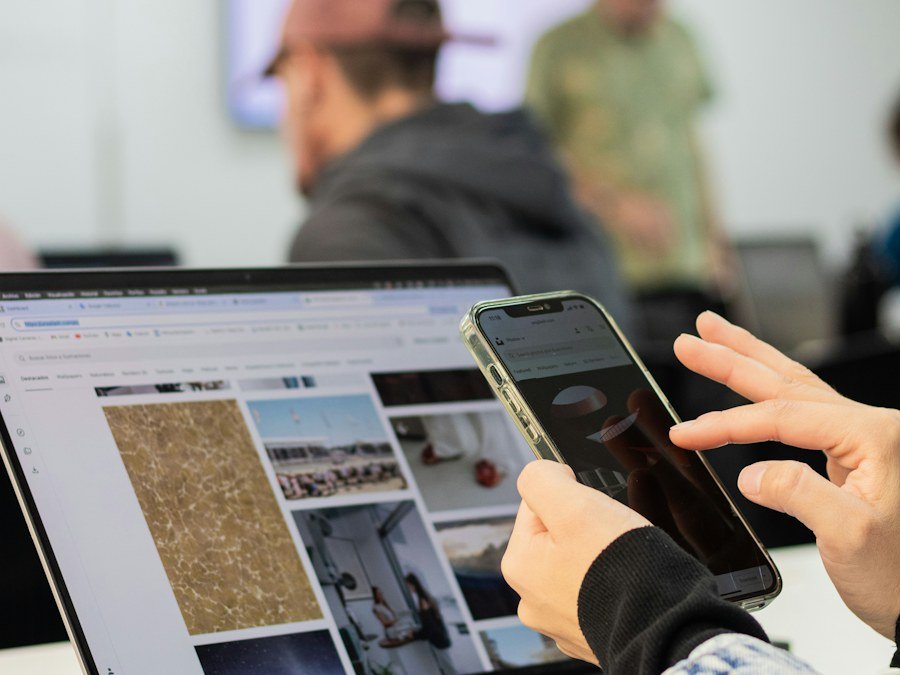 A mobile interface being reviewed alongside a computer